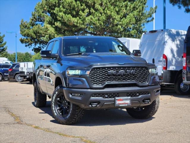 2026 RAM 1500 RAM 1500 REBEL CREW CAB 4X4 5'7' BOX in Forged Blue Metallic Exterior Paint — front three-quarter view