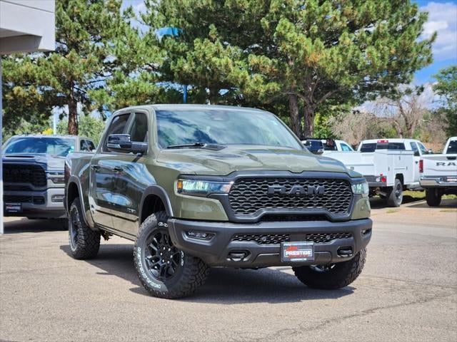 2026 RAM 1500 RAM 1500 REBEL CREW CAB 4X4 5'7' BOX in Tank Exterior Paint — front three-quarter view
