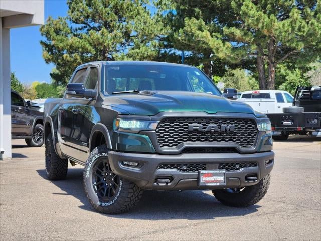 2026 RAM 1500 RAM 1500 REBEL CREW CAB 4X4 5'7' BOX in Serrano-Green Metallic Exterior Paint — front three-quarter view