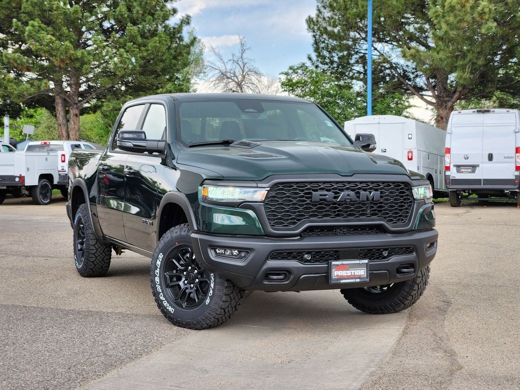 2026 RAM 1500 RAM 1500 REBEL CREW CAB 4X4 5'7' BOX in Serrano-Green Metallic Exterior Paint — front three-quarter view