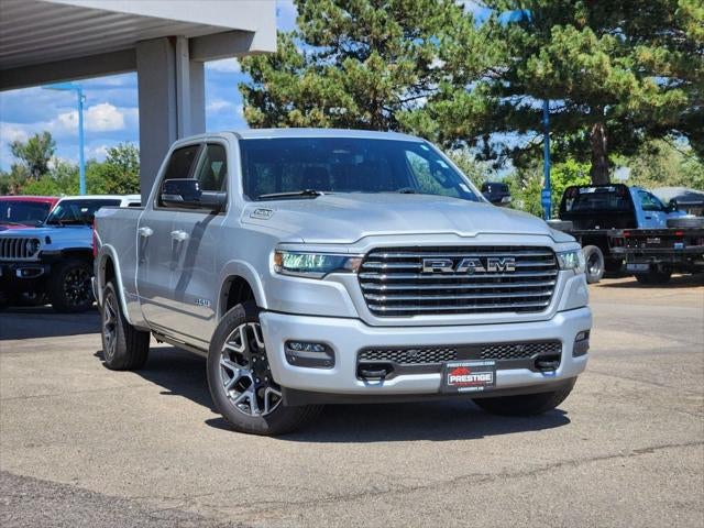 2026 RAM 1500 RAM 1500 LARAMIE CREW CAB 4X4 6'4' BOX in Silver Zynith Exterior Paint — front three-quarter view