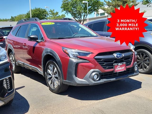 2024 Subaru Outback Limited XT in Crimson Red Pearl — front three-quarter view